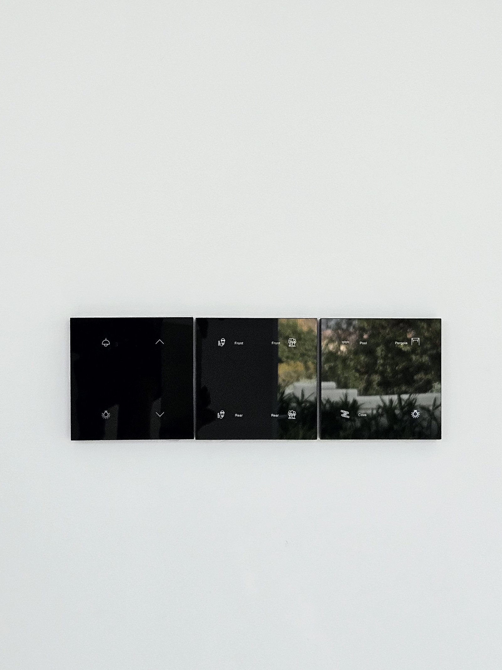 Design switches in matte black on travertine